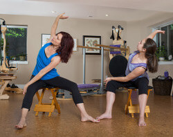 Group GYROKINESIS class in the studio with participants on mats